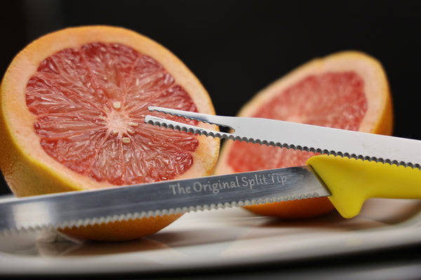 Close up of split tip and The Original Split Tip logo with a sliced citrus in the background.